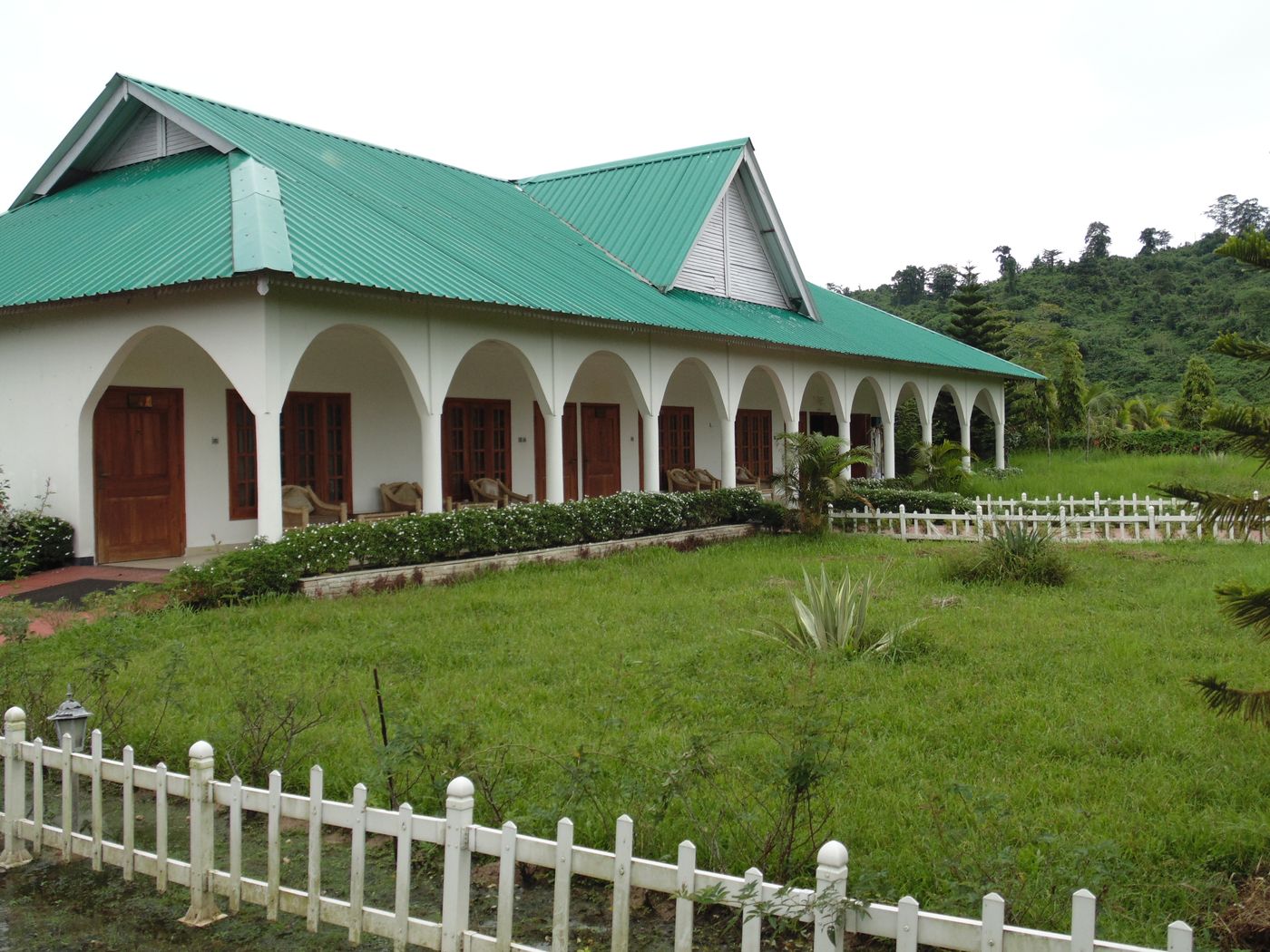 Arched veranda with cane chairs